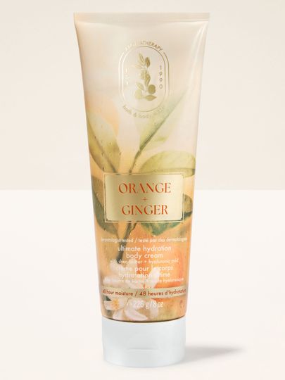 Tělový krém Bath & Body Works Aromatherapy Orange + Ginger 226 g ve světlé tubě s rostlinným motivem.