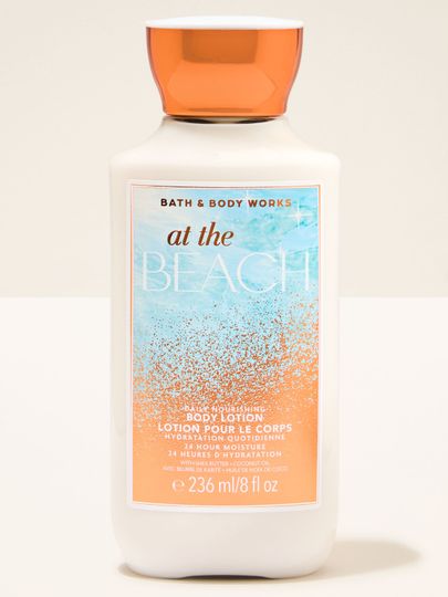 Tělové mléko At the Beach Bath & Body Works ve světlé lahvi s oranžovým víčkem