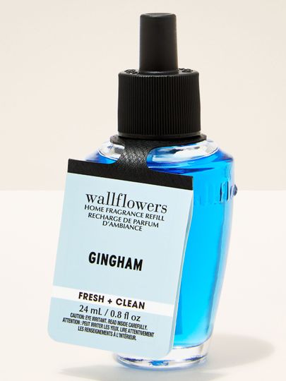 Náplň Wallflowers Gingham se svěží vůní v sytě modré lahvičce o objemu 24 ml.
