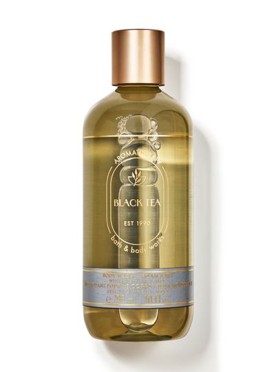 Sprchový gel a pěna do koupele Bath & Body Works Aromatherapy "Black Tea" v průhledné lahvi.