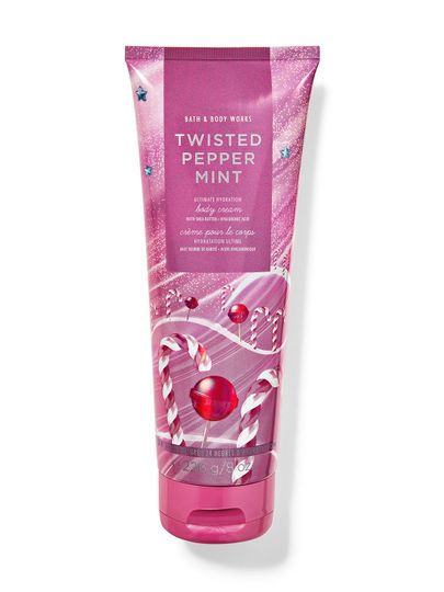 Różowy krem do ciała z brokatem i motywem białych i czerwonych lasek cukrowych. Bath & Body Works.
