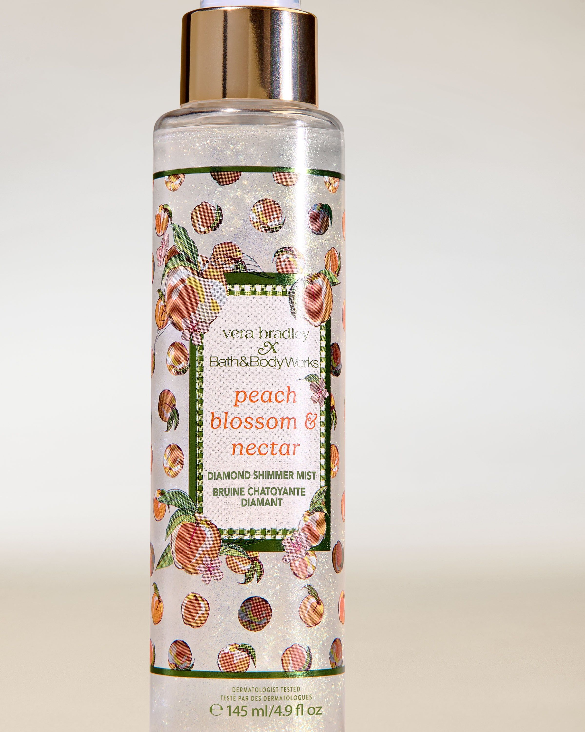 Bath & Body Works Peach Blossom & Nectar – třpytivá parfémová mlha Diamond Shimmer v průhledném flakonu se zlatým rozprašovačem.