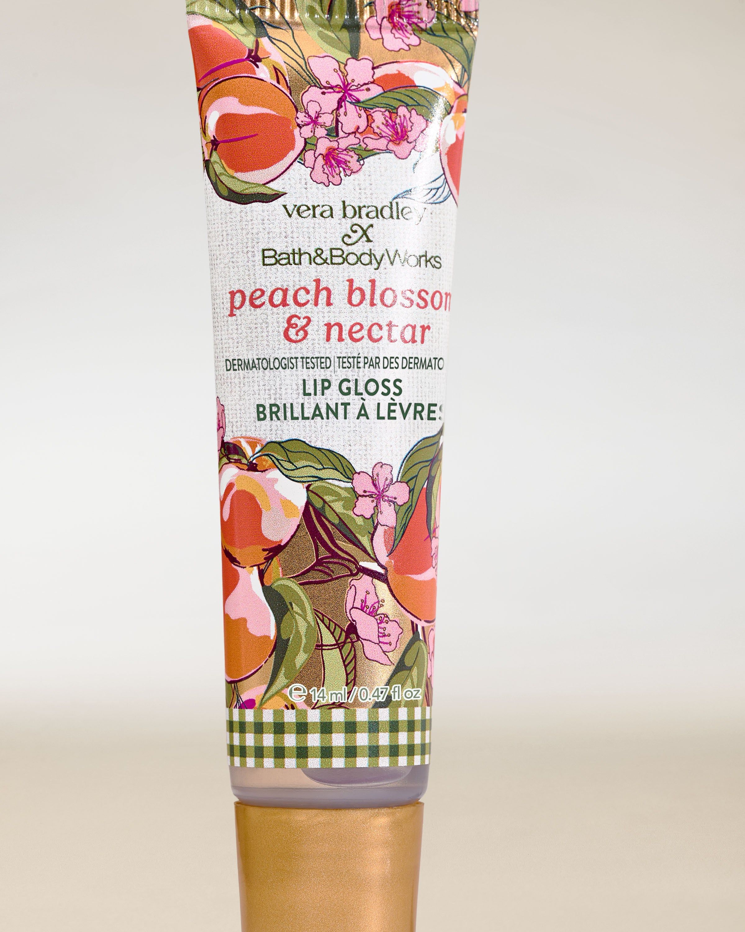 Bath & Body Works Peach Blossom & Nectar – lesk na rty v tubě s broskvově‑květinovým motivem.