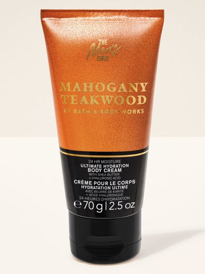 Tělový krém Bath&Body Works Mahogany Teakwood. Malá, kovová tuba v hnědé barvě s černou etiketou a nápisy.