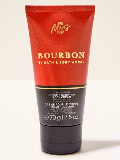 Tělový krém Bath&Body Works Bourbon. Malá, kovová tuba v bordó barvě s černou etiketou a nápisy.