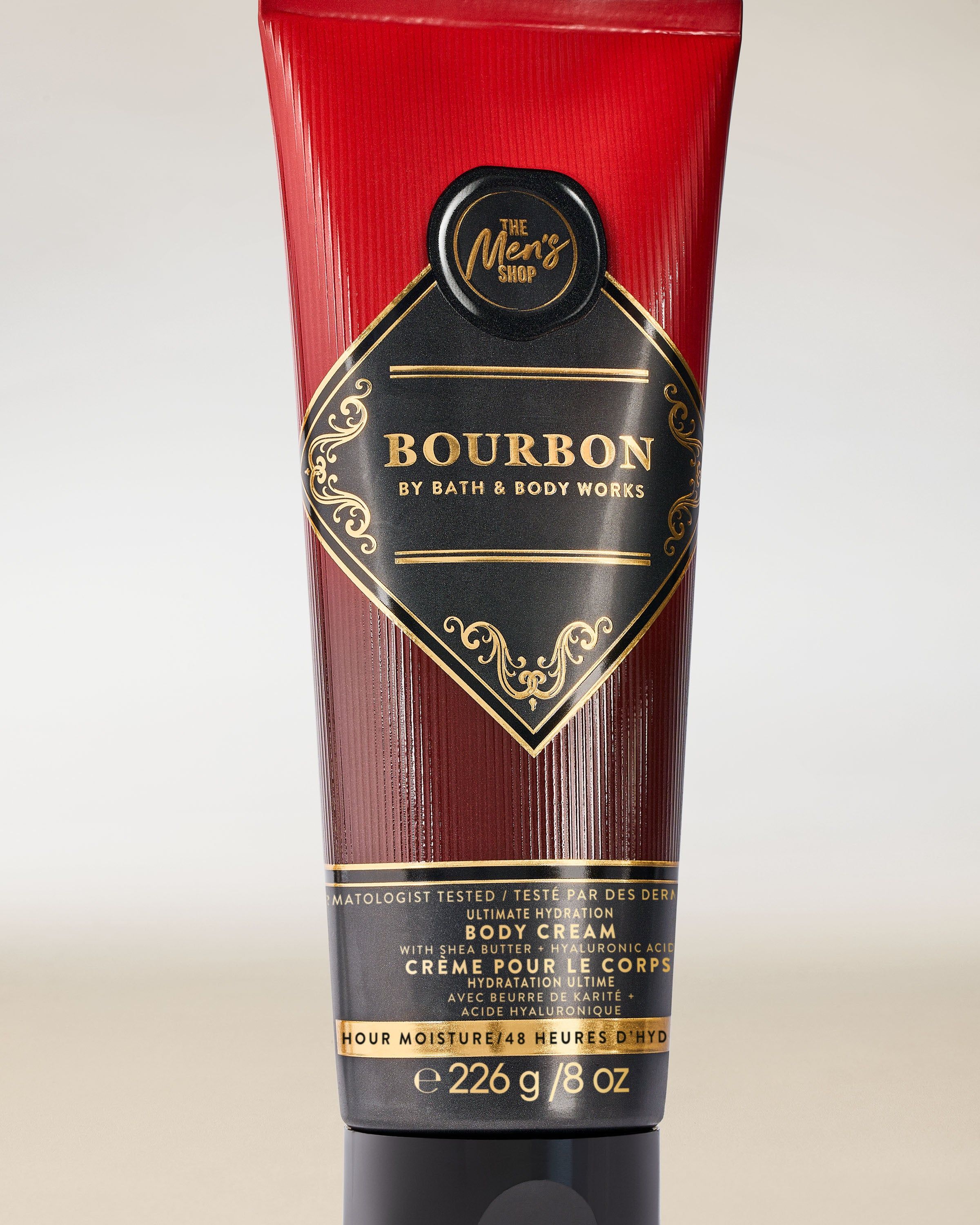 Bath & Body Works Bourbon – tělový krém pro muže v tubě v černo‑bordových tónech s dekorativním štítkem.