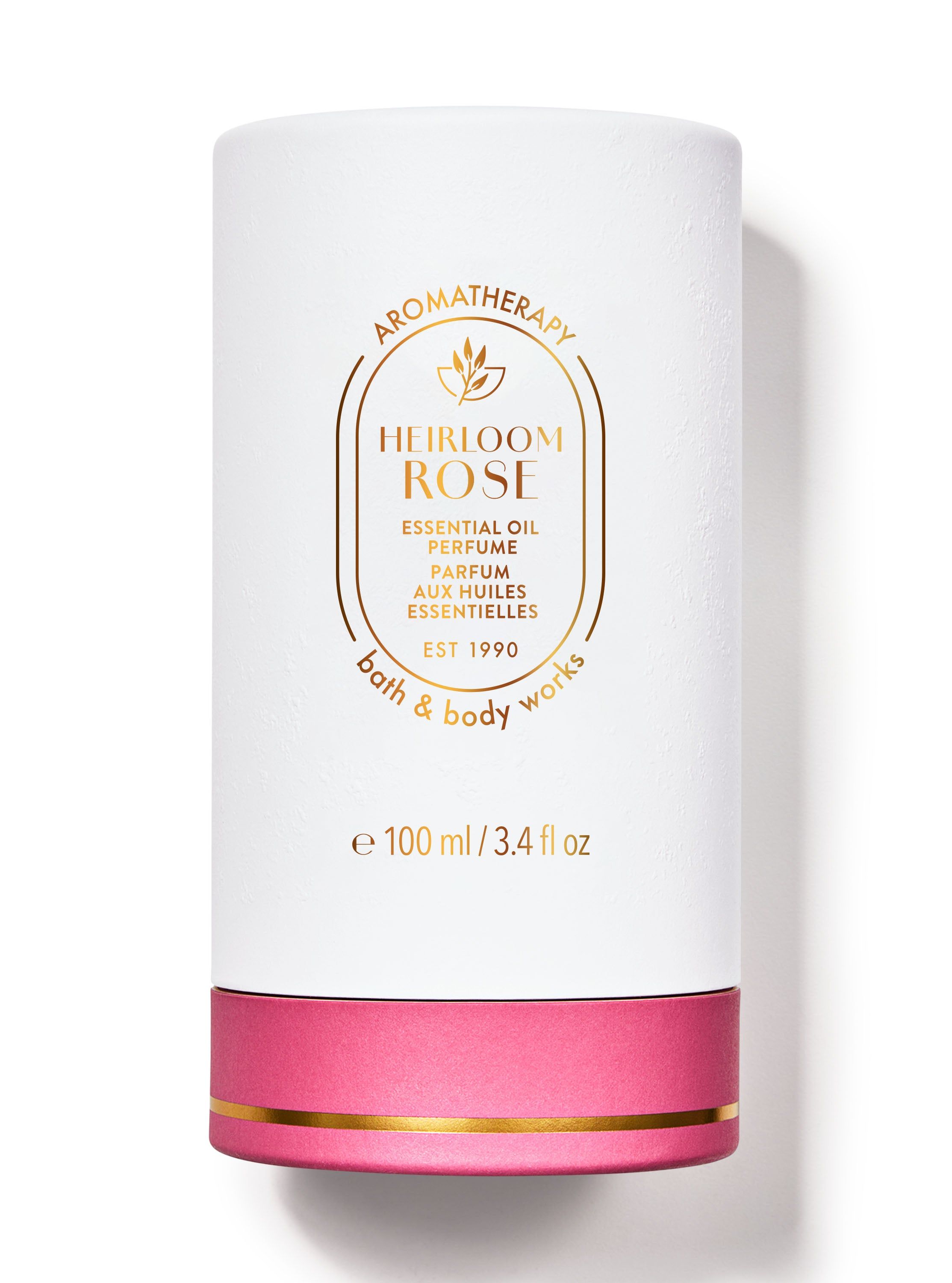Obal parfému Bath & Body Works Aromatherapy "Heirloom Rose" v bílé, růžové a zlaté barvě.