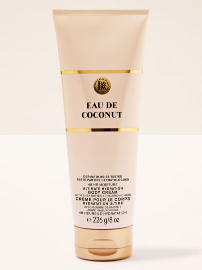 Tělový krém Eau de Coconut Bath & Body Works v béžové tubě se zlatými prvky – intenzivní kokosová hydratace.