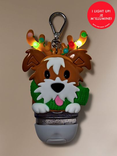 Świąteczne etui na żel do rąk w kształcie psa z podświetlanymi rogami, ubranego w zielony szalik, Bath & Body Works.