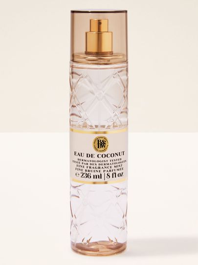 Bath & Body Works Eau de Coconut – čirá voňavá mlha v reliéfní lahvi se zlatým rozprašovačem.