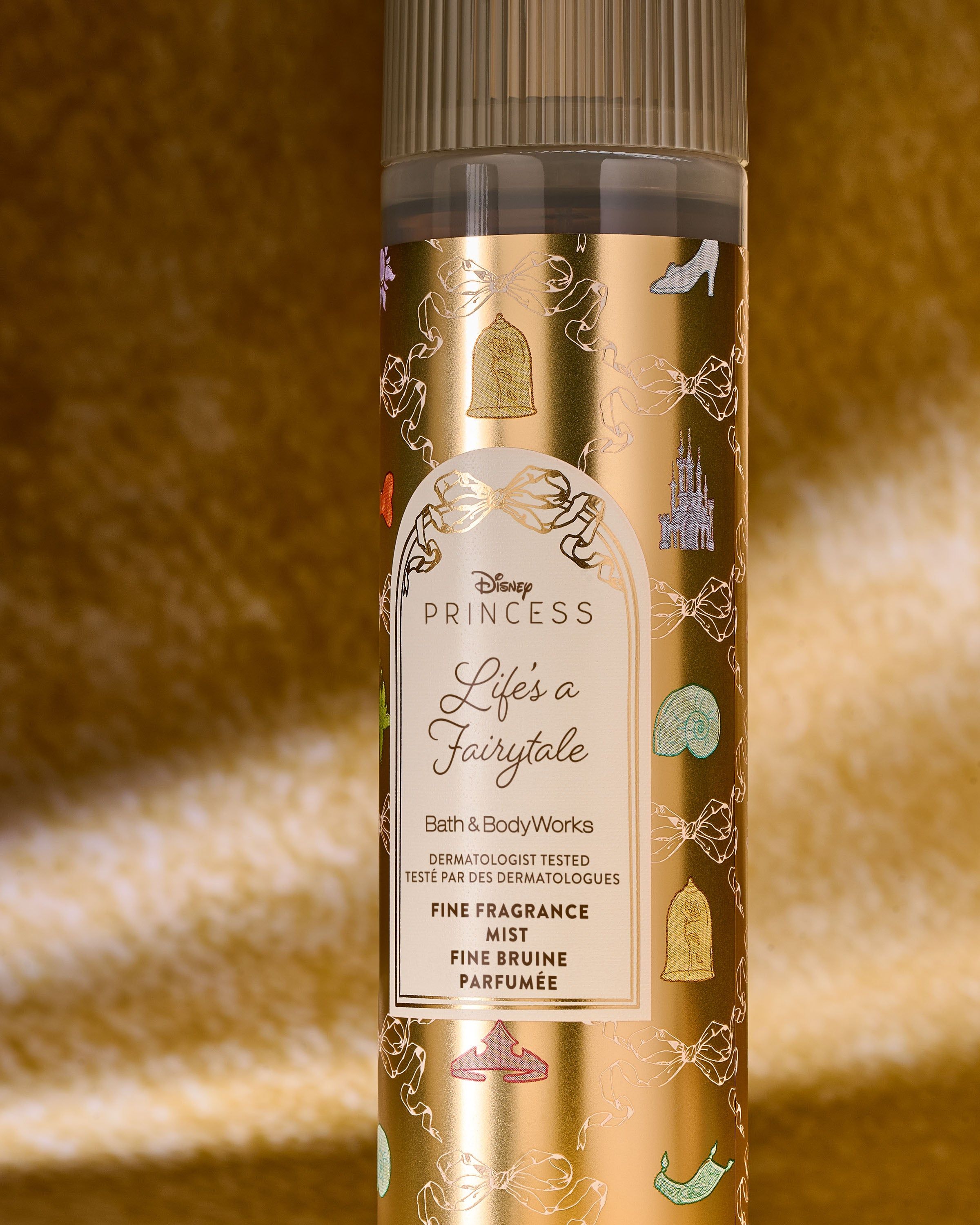 Vonná mlha Life’s a Fairytale – zlatý design s ikonami princezen a lehká pohádková svěžest.