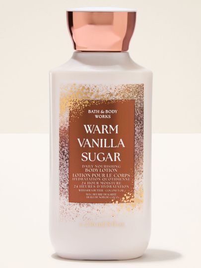 Tělové mléko Bath & Body Works Warm Vanilla Sugar ve světlé lahvi s měděným uzávěrem