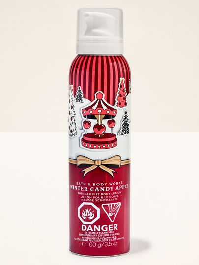 Tělová pěna Winter Candy Apple Bath & Body Works v červeném obalu s motivem kolotoče a jablek