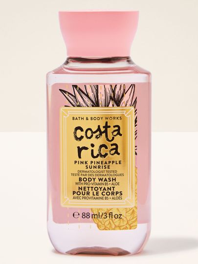 Mini sprchový gel Costa Rica Pink Pineapple Sunrise v růžové lahvi s tropickou etiketou a růžovým víčkem.