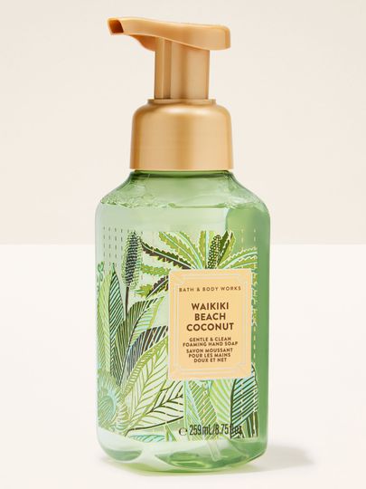 Waikiki Beach Coconut – pěnové mýdlo v zeleném průhledném obalu se zlatou pumpičkou a tropickou etiketou s palmami.