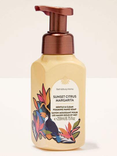Sunset Citrus Margarita – pěnové mýdlo v žlutém obalu s měděnou pumpičkou a tropickou etiketou s tukanem.