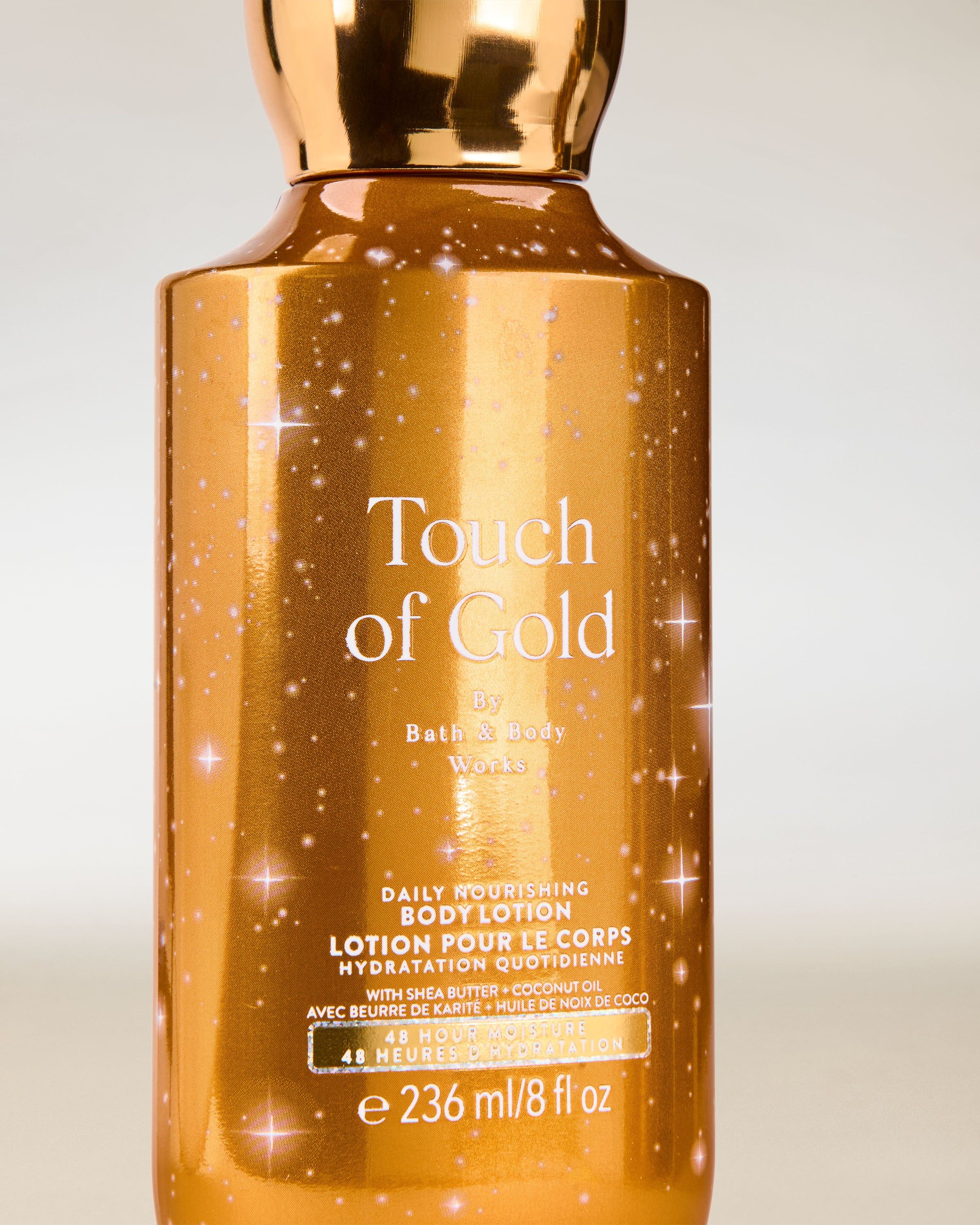 Tělové mléko Touch of Gold od Bath & Body Works ve zlatém lesklém obalu s hydratační formulí.