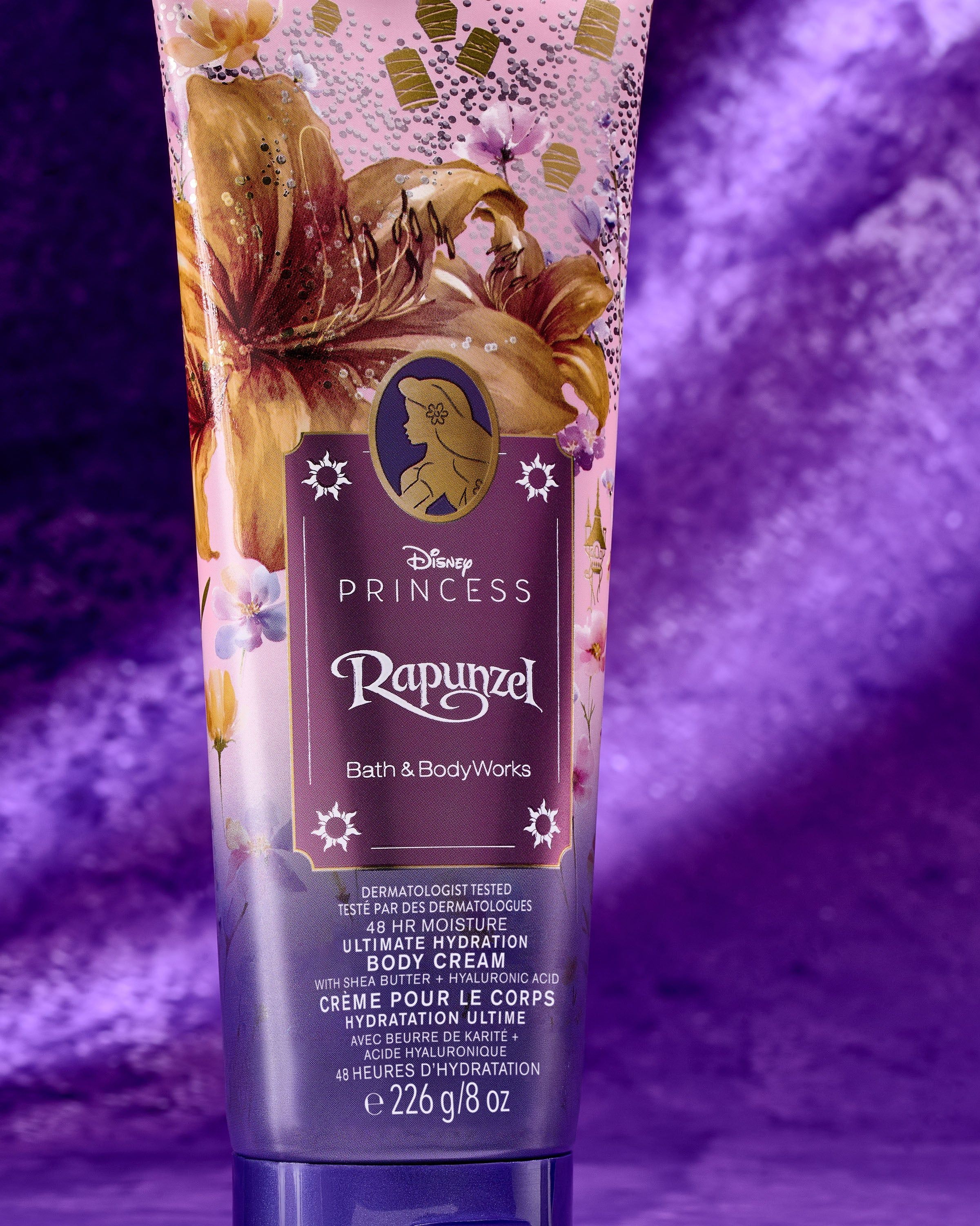 Tělový krém Rapunzel Disney Princess – růžovo‑fialový design se zlatými detaily a 48h hydratací.