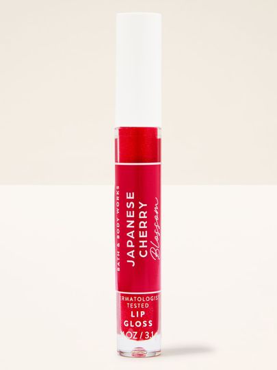 Lesk na rty Japanese Cherry Blossom v praktické tubě, určený pro snadné použití a lesklý efekt.