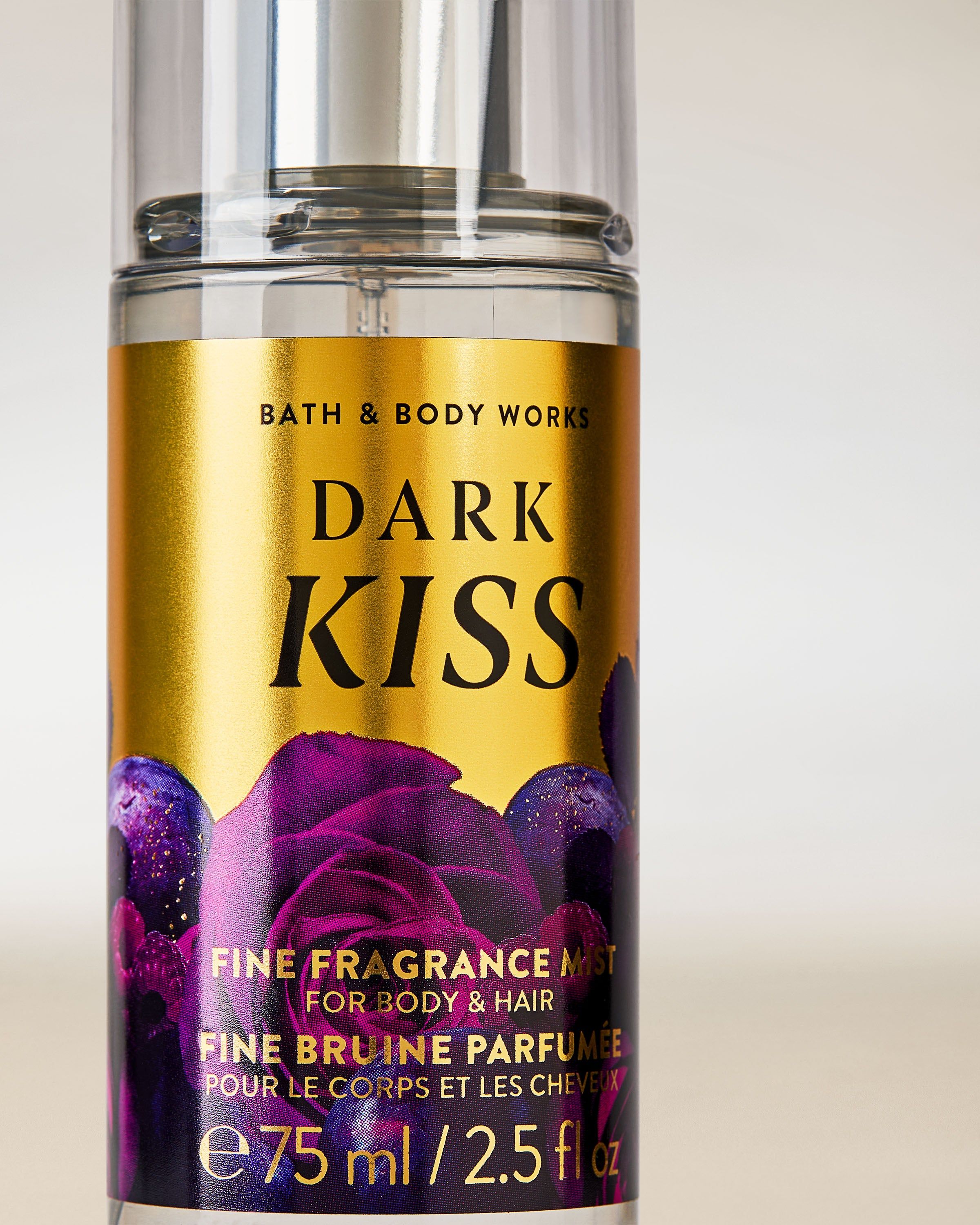Mini vůně Dark Kiss ve zlatofialové lahvičce s motivem růží.
