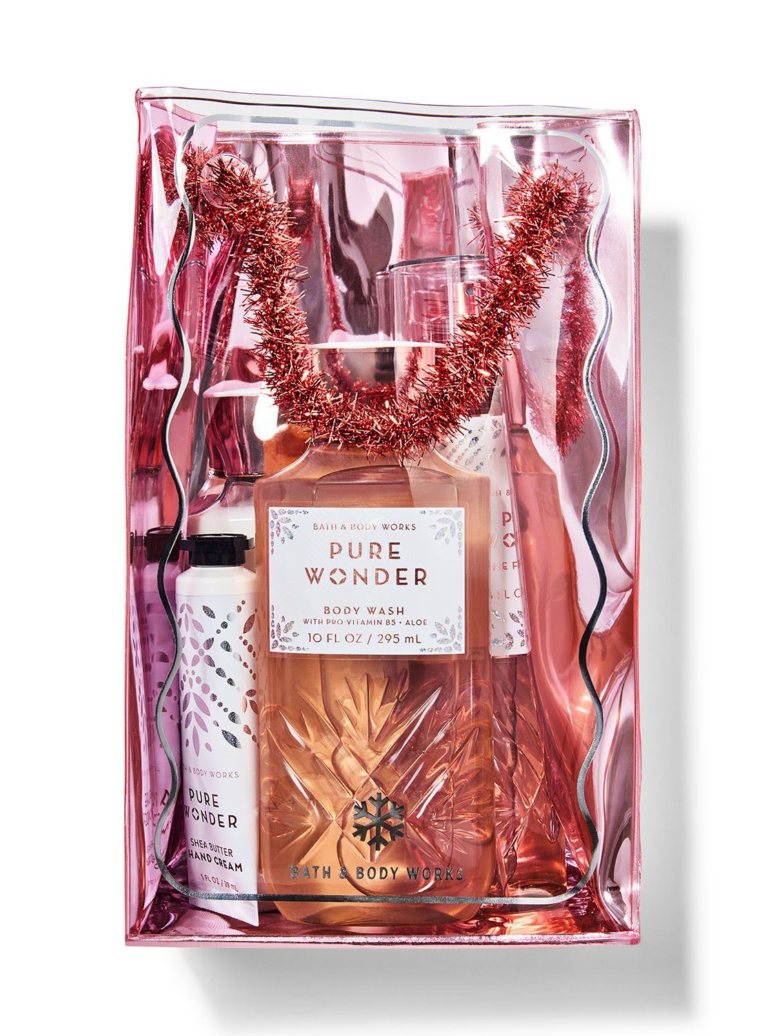 Zestaw podarunkowy „Pure Wonder” w przezroczystej kosmetyczce z różowej folii z ozdobną girlandą, Bath & Body Works.