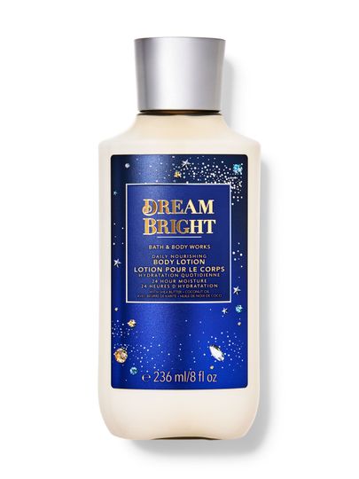 Tělové mléko Bath & Body Works "Dream Bright" v krémové lahvi s modrou etiketou s hvězdami.