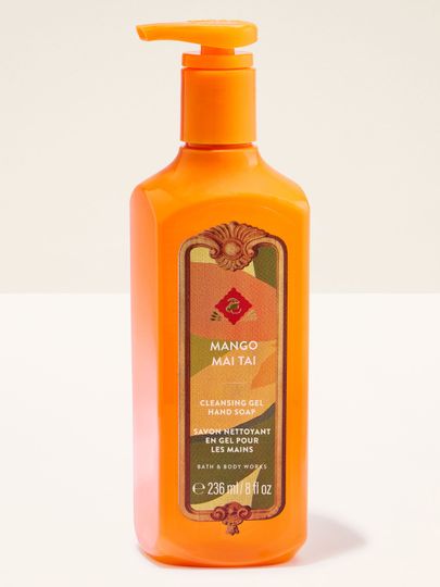 Gelové mýdlo Bath & Body Works Mango Mai Tai v oranžové lahvi s tropickou etiketou.