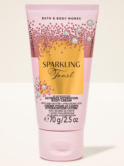 Mini tělový krém Sparkling Toast Bath & Body Works v růžové tubě se zlatou třpytivou etiketou