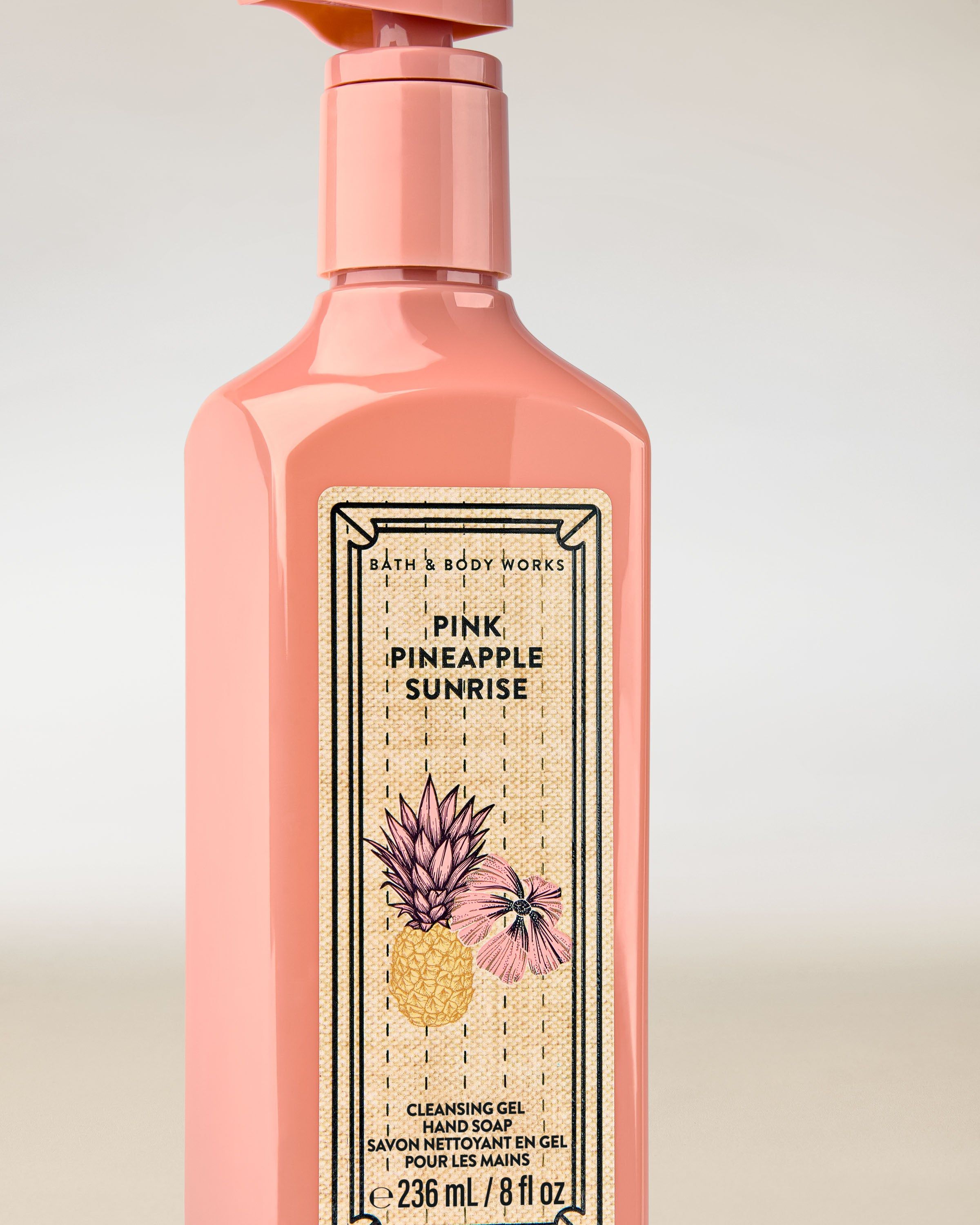 Pink Pineapple Sunrise – gel na ruce v růžovém obalu s pumpičkou a tropickou etiketou s ananasem.