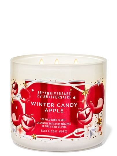 Świeca „Winter Candy Apple” z etykietą z okazji 25. rocznicy i ilustracją jabłek i gwiazd, Bath & Body Works.