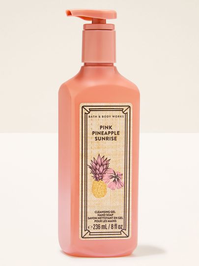Pink Pineapple Sunrise – gel na ruce v růžovém obalu s pumpičkou a tropickou etiketou s ananasem.