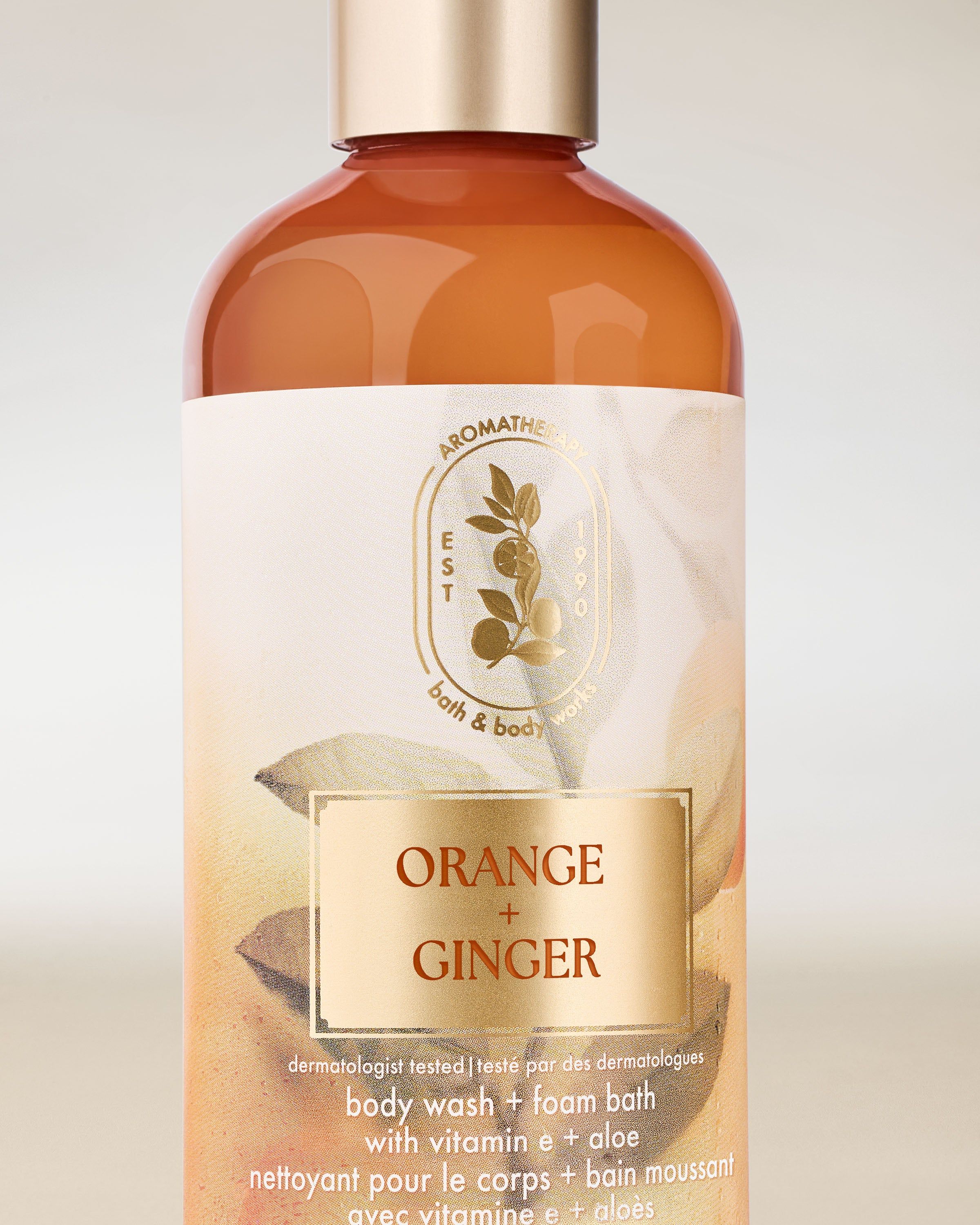 Sprchový gel Bath & Body Works Aromatherapy Orange + Ginger 295 ml v oranžové lahvi s uzávěrem.