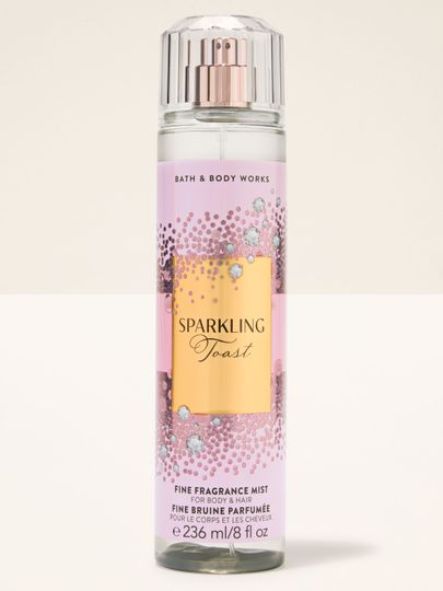 Tělová mlha Sparkling Toast Bath & Body Works v růžové lahvi se zlatou třpytivou etiketou