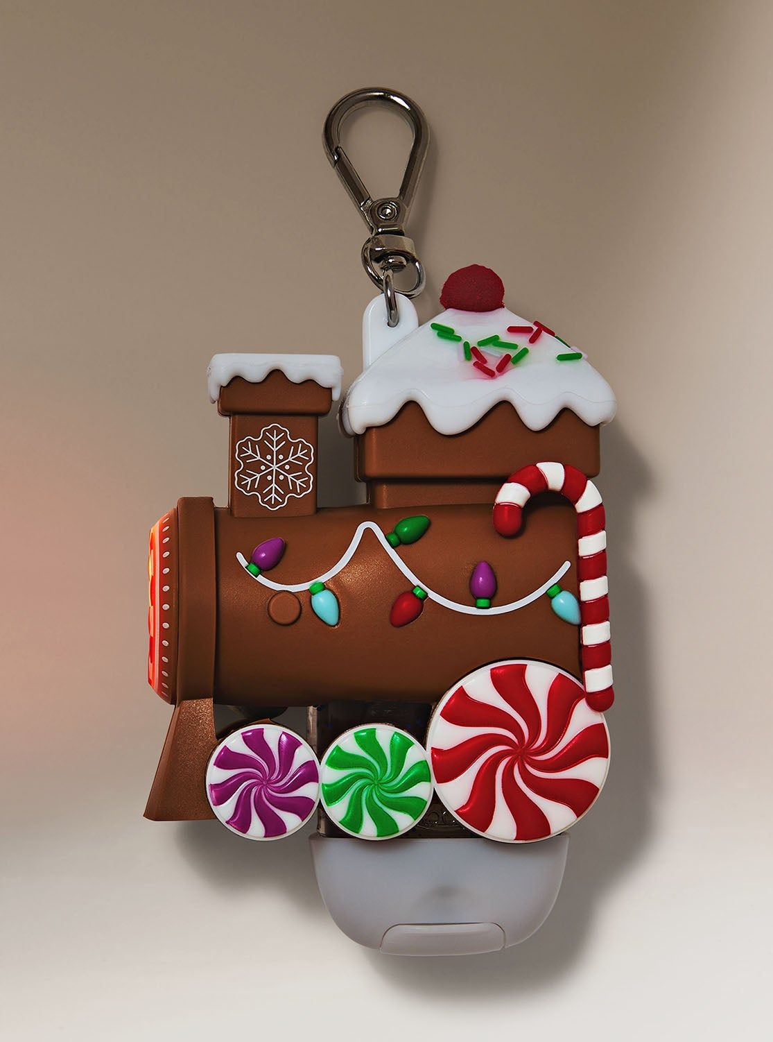 Świąteczne etui na żel do rąk w kształcie pociągu z piernika, ozdobione cukierkami, Bath & Body Works.