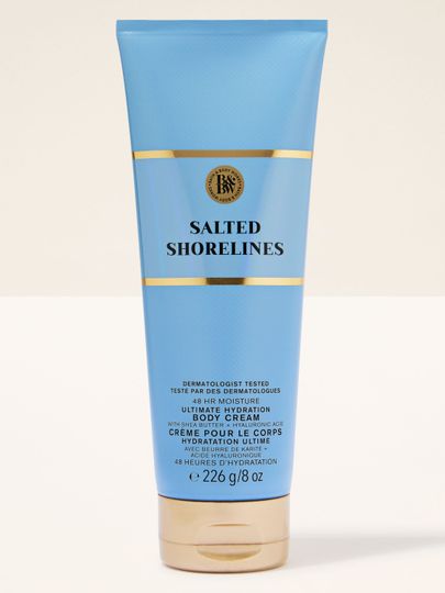 Tělový krém Bath & Body Works v modré tubě se zlatými akcenty a čistou, minimalistickou etiketou.