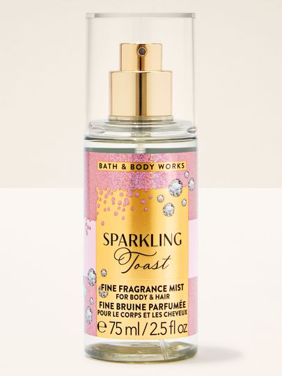 Mini tělová mlha Sparkling Toast Bath & Body Works v čiré lahvi se zlatou etiketou