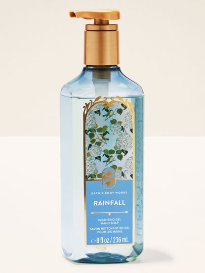 Bath & Body Works Rainfall – gel na ruce v modré lahvi s květinovou etiketou