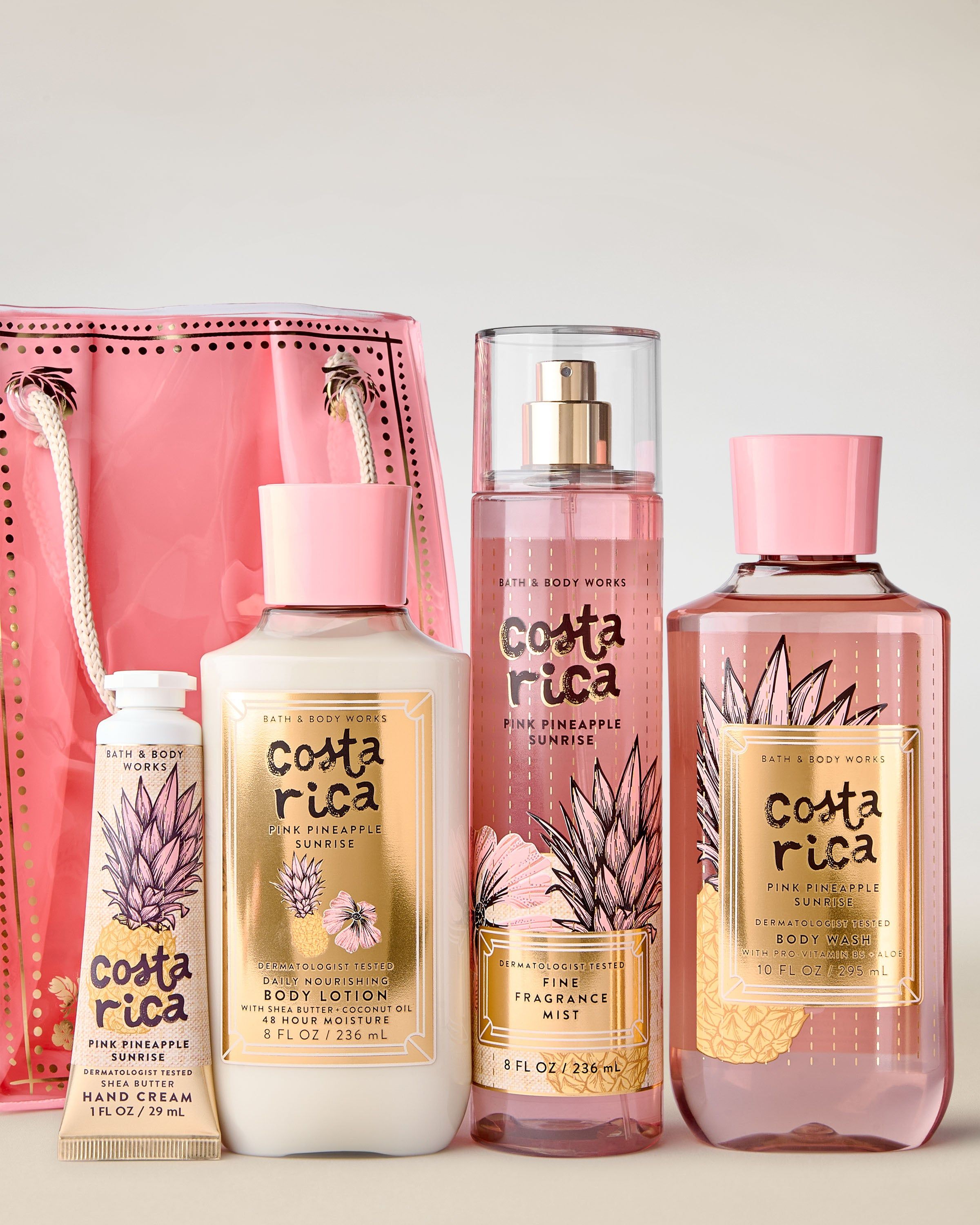 Sada Costa Rica Pink Pineapple Sunrise s růžovou taškou a čtyřmi tropickými produkty péče.