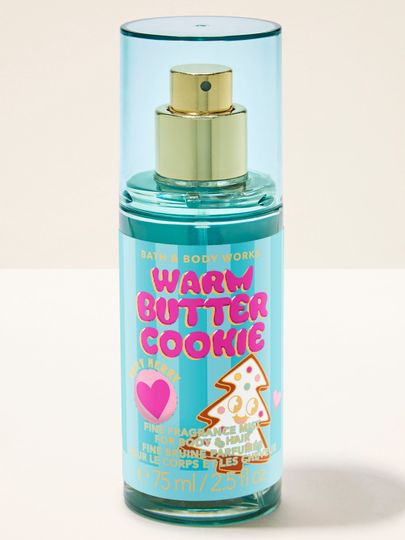 Tělová parfémová mlha Warm Butter Cookie Bath & Body Works ve světle modrém flakonu s motivem sušenky ve tvaru stromku