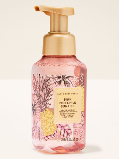 Pink Pineapple Sunrise – pěnové mýdlo v růžovém obalu se zlatou pumpičkou a tropickým motivem ananasu.