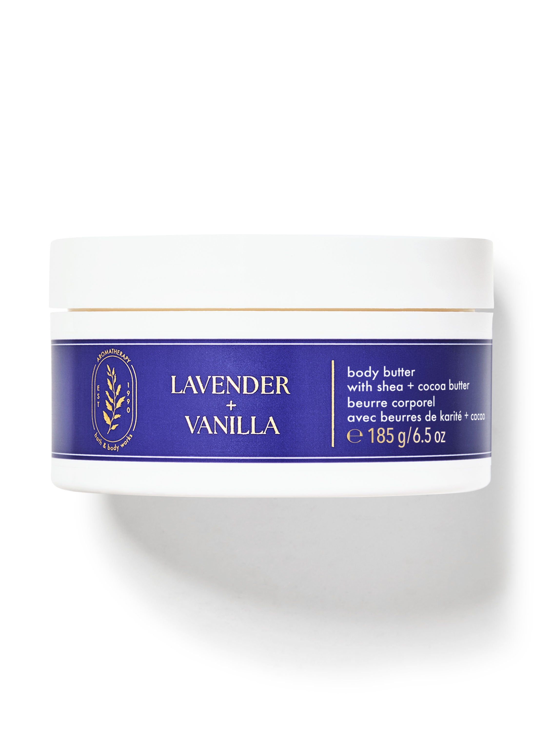 Tělové máslo "Lavender + Vanilla" v nádobě s modrým štítkem se zlatými listy. Bath & Body Works.