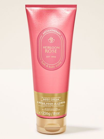 Tělový krém Heirloom Rose Aromatherapy v růžové tubě s intenzivně hydratační a zklidňující formulí.