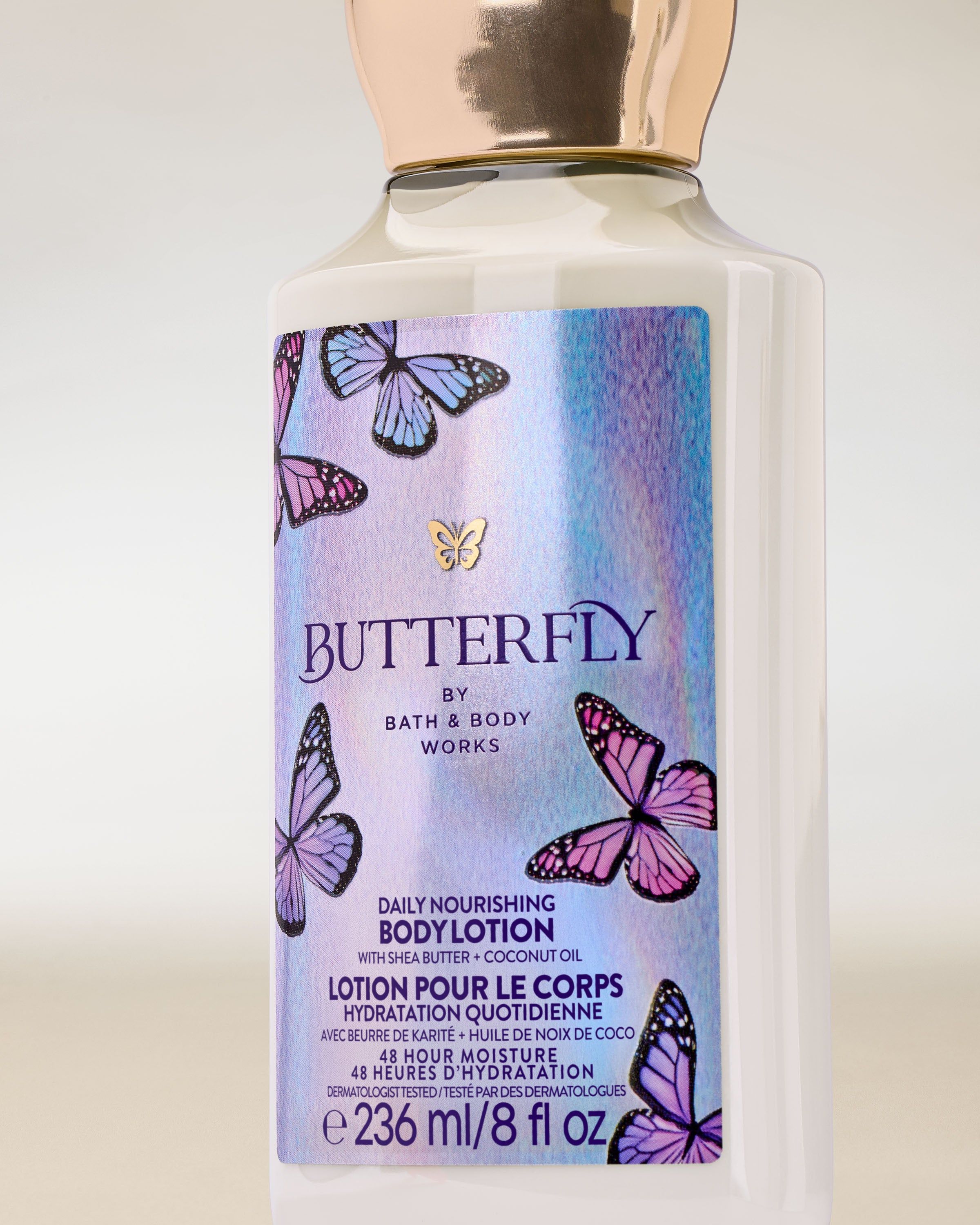 Tělové mléko Butterfly Bath & Body Works ve světlé lahvi s holografickým štítkem a motivem motýlů