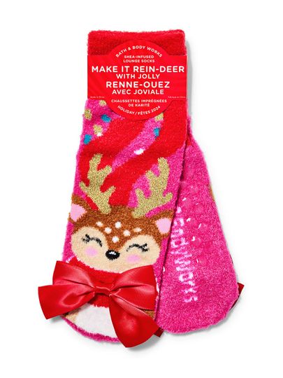 Różowe skarpety świąteczne z wizerunkiem renifera i czerwoną kokardą. Bath & Body Works.