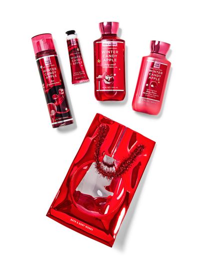 Zestaw "Winter Candy Apple" z mgiełką, żelem, balsamem i kremem do rąk, w czerwonej torbie. Bath & Body Works.