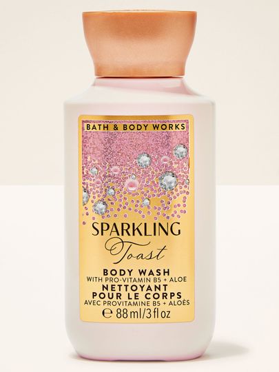 Malý sprchový gel Sparkling Toast Bath & Body Works v lahvi s růžovo‑zlatou etiketou