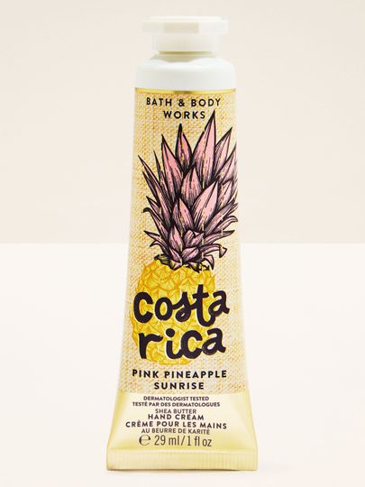 Krém na ruce Costa Rica Pink Pineapple Sunrise ve žluté tubě s ananasovou ilustrací a tropickým motivem.