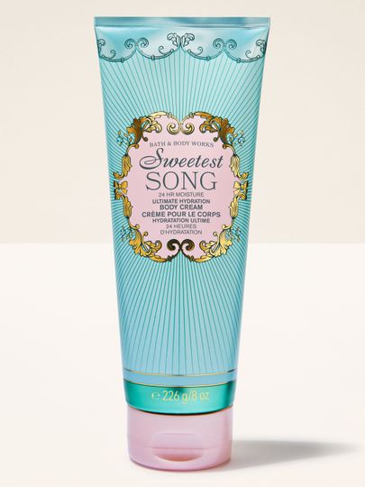 Tělový krém Sweetest Song Bath & Body Works v tyrkysové tubě s ozdobným štítkem