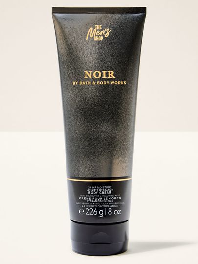 Tělový krém Bath&Body Works Noir. Velká, černá tuba se třpytkami a nápisy ve zlaté barvě.
