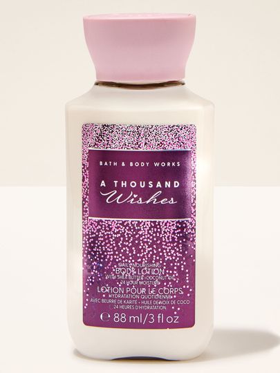 Mini tělové mléko Bath & Body Works A Thousand Wishes s růžovo‑fialovou třpytivou etiketou.